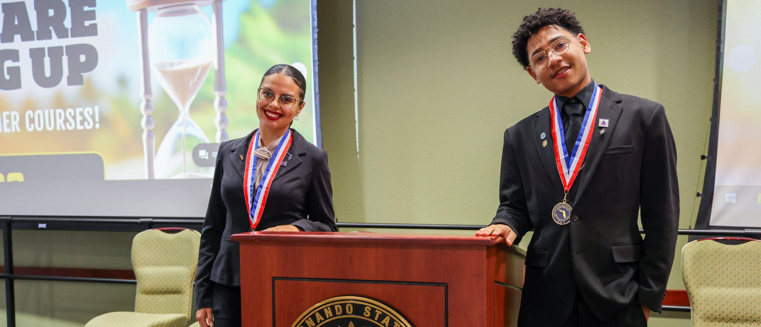 Two PHSC students dressed in business attire